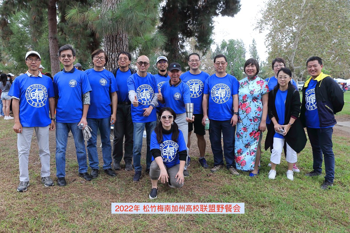 A group of people in blue shirts and jeans.